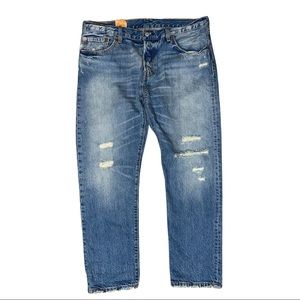 Levi 501ct Distressed Tapered Leg with Button Fly. Size: 31W 32L